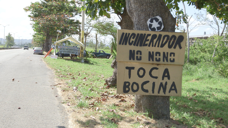 Signs near the camp outside the proposed incinerator site in Arecibo, Puerto Rico.